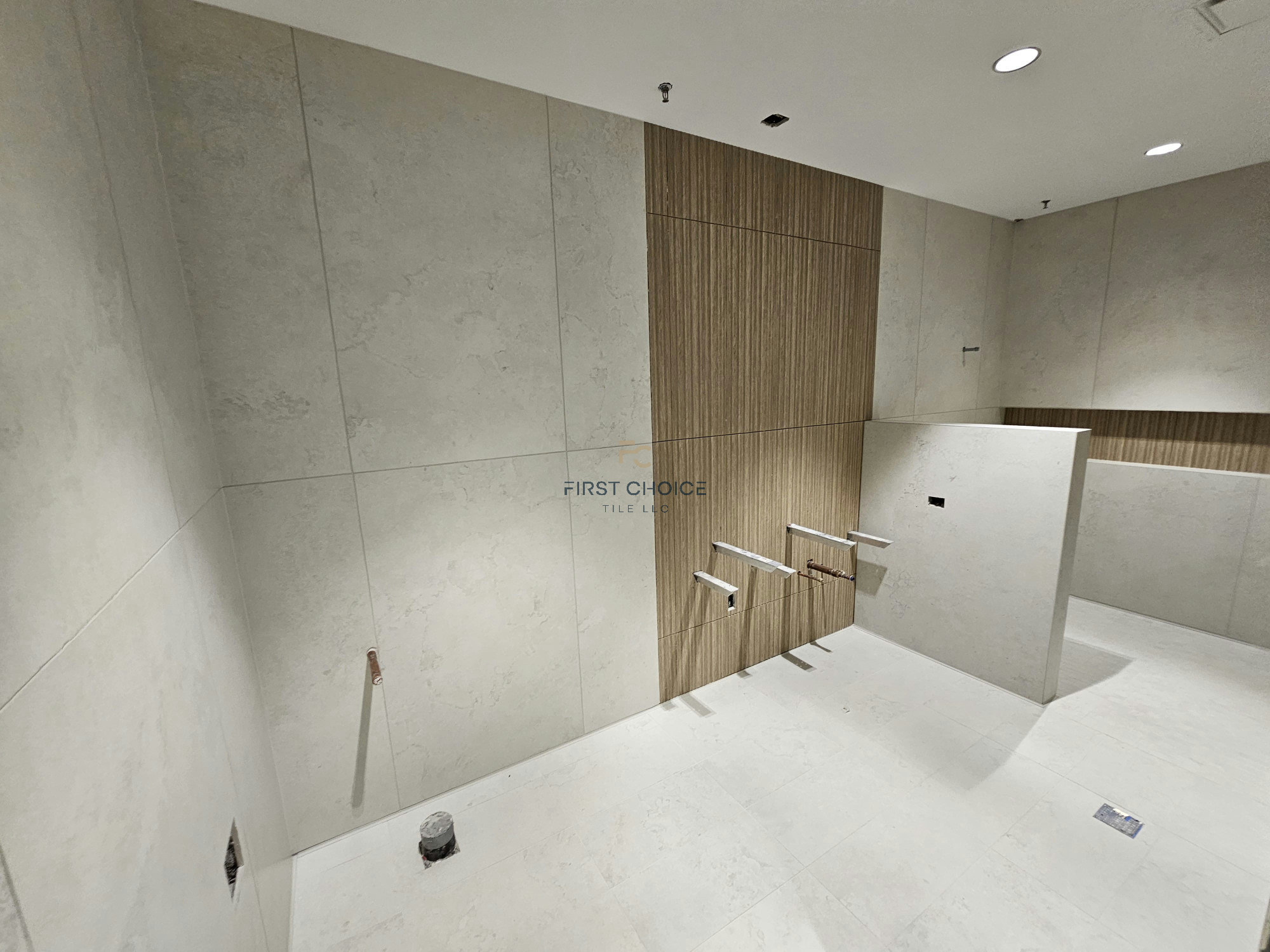 Large format tile bathroom after renovation — Bathroom project completed by First Choice Tile