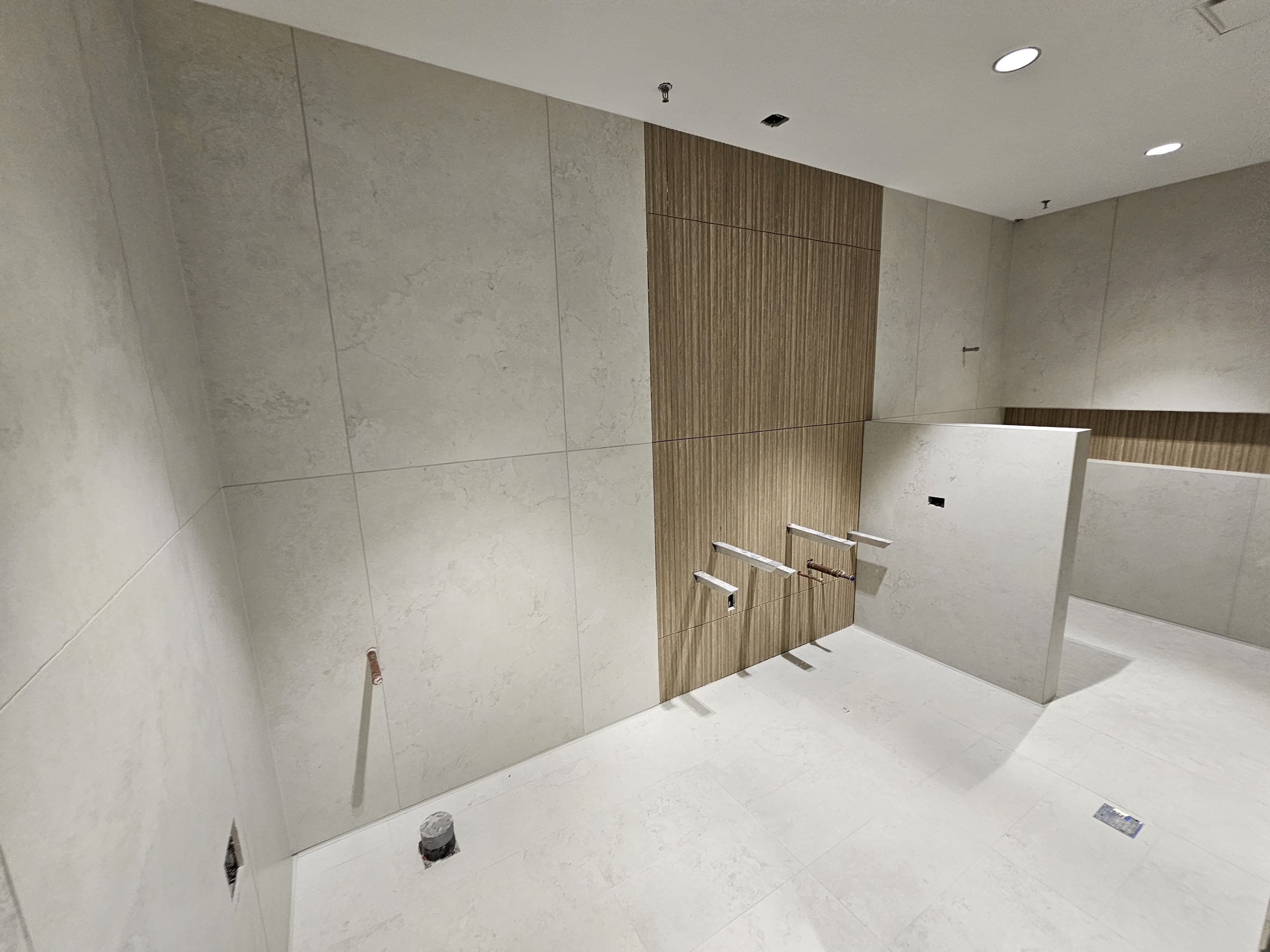 Large format tile bathroom after renovation - professional bathroom installation by First Choice Tile