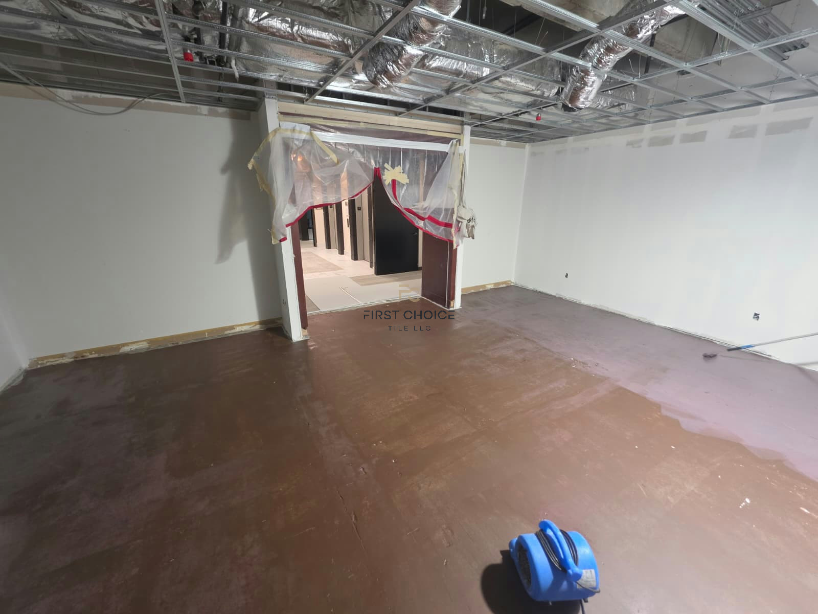 Concrete slab prepared with MAPEI Mapelastic CI membrane before tile installation.